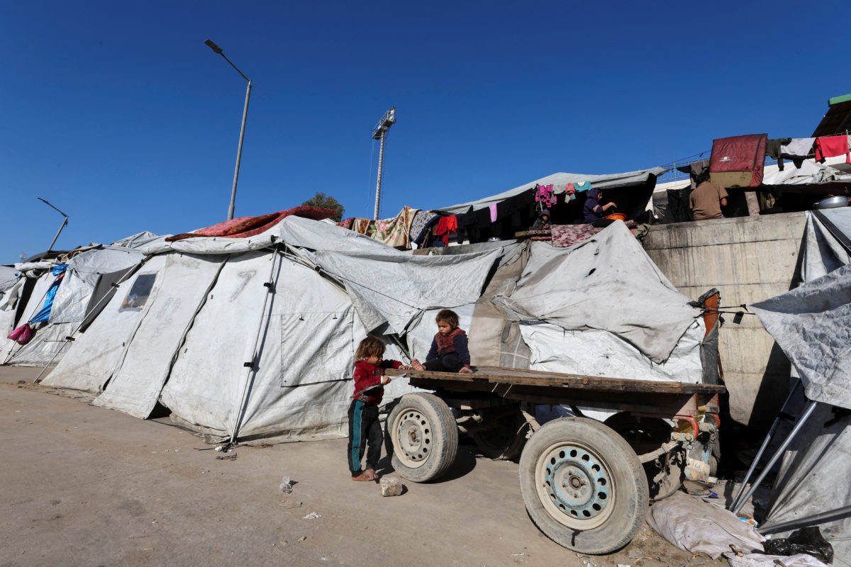 Palestinian children displaced during the two-year Israeli offensive, play as they shelter at a tent camp in Gaza City, March 1, 2026. Photo by Dawoud Abu Alkas/ Reuters