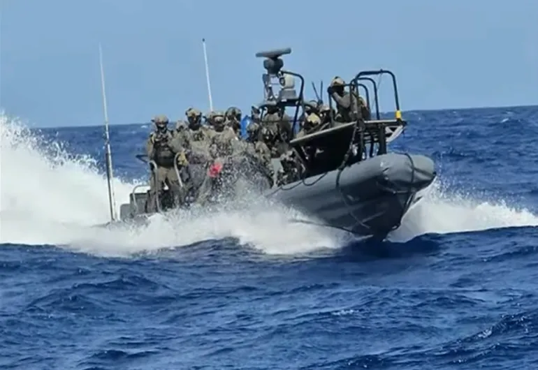 Israeli forces intercept aid flotilla boats approximately 250 nautical miles from Gaza in international waters.