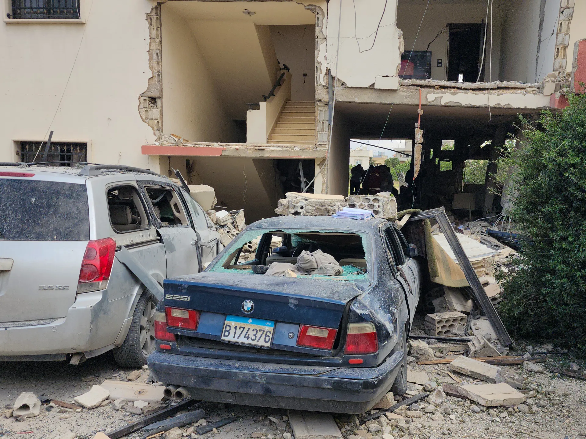 Emergency workers inspect the damage after an Israeli strike on an apartment building in Baalbek on May 18, 2026 [AFP]
