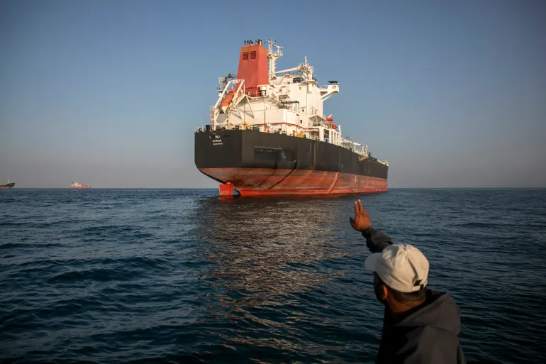 Ship anchored near Larak Island in Strait of Hormuz, disrupted by US-Israel military operations.