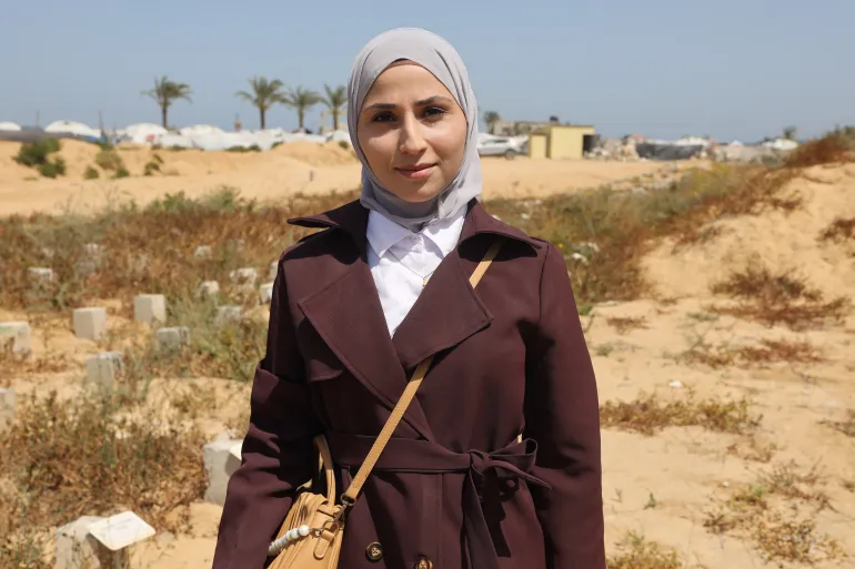 Lina al-Assi grieves at the cemetery where her husband disappeared during the October 2023 war.