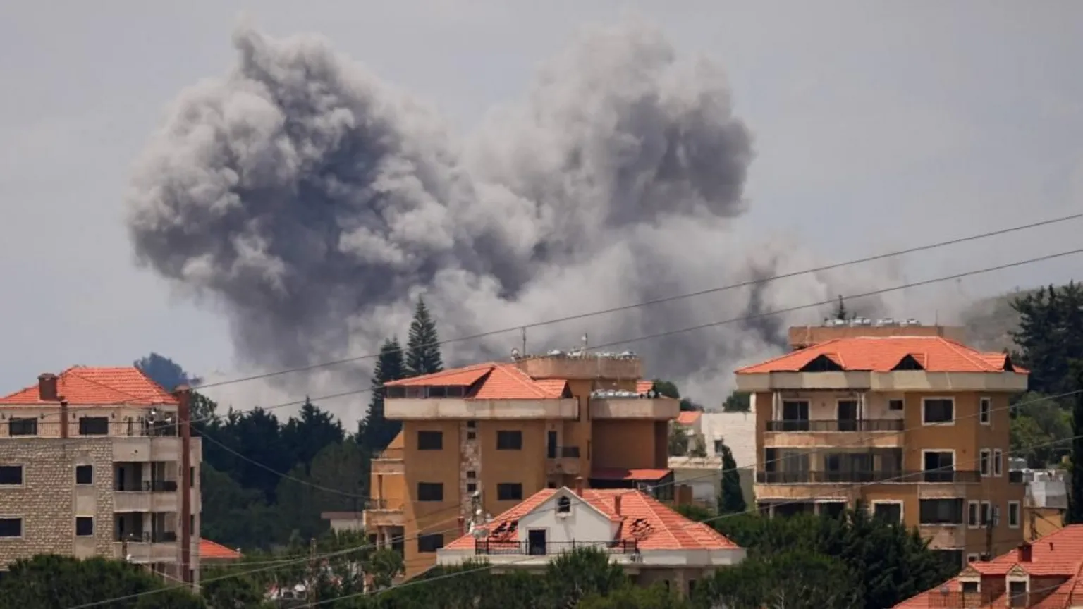 Smoke rises from Nabatieh in southern Lebanon following Israeli bombardment targeting over 100 Hezbollah sites.