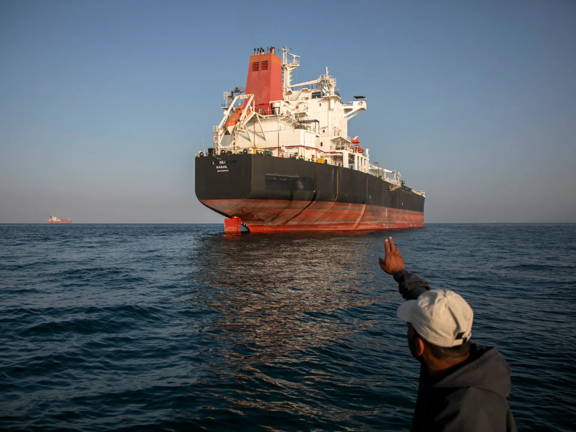 A ship remains anchored in the Strait of Hormuz near Larak Island, Iran [File: Majid Saeedi/Getty Images]