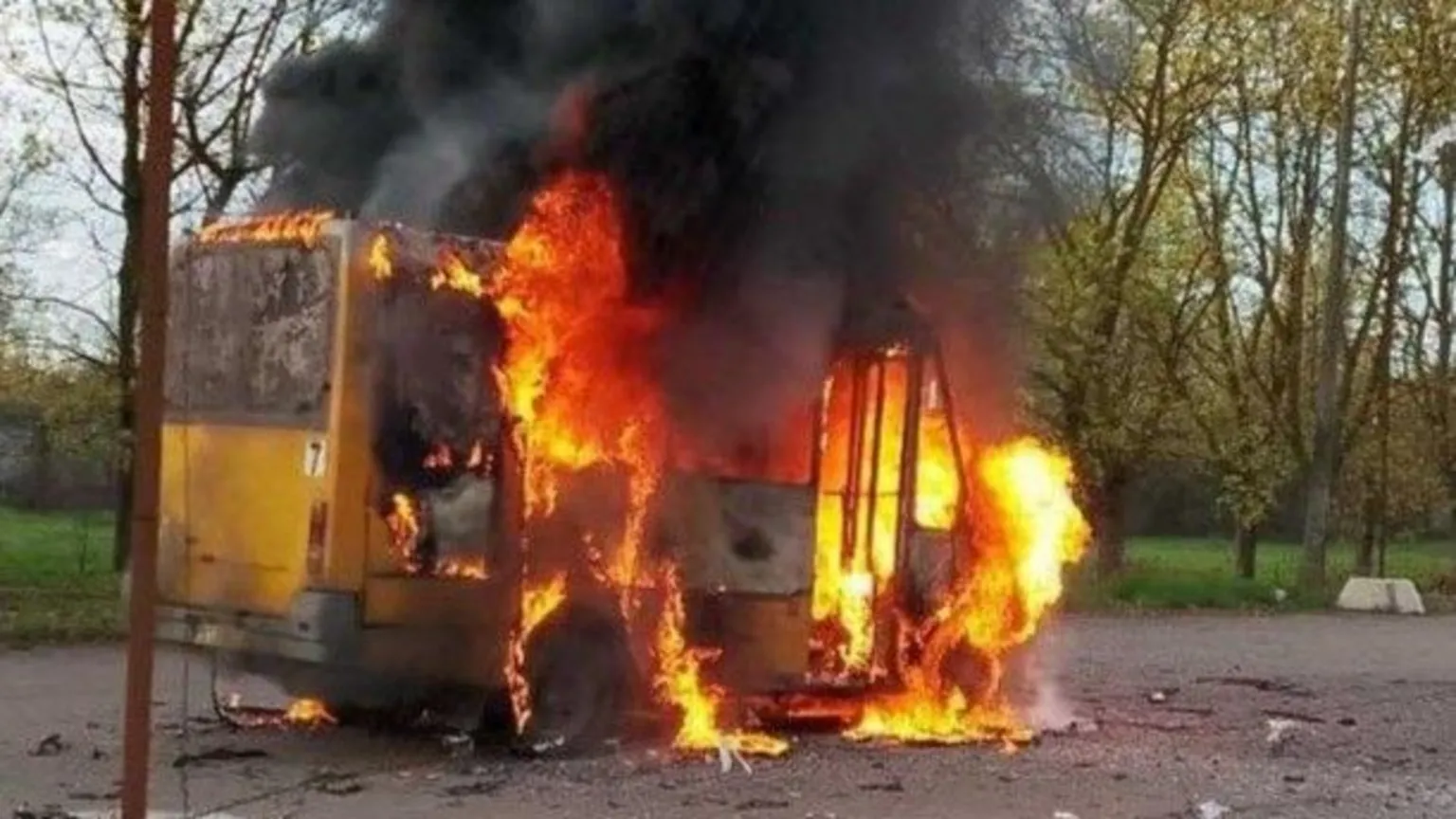 Destroyed Kherson bus after drone strike; 27 buses bombed this year with three transport workers killed.