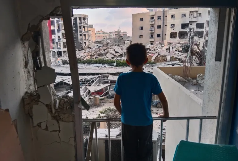 A boy surveys destruction at Jabal Amel Hospital following an Israeli airstrike in southern Lebanon.