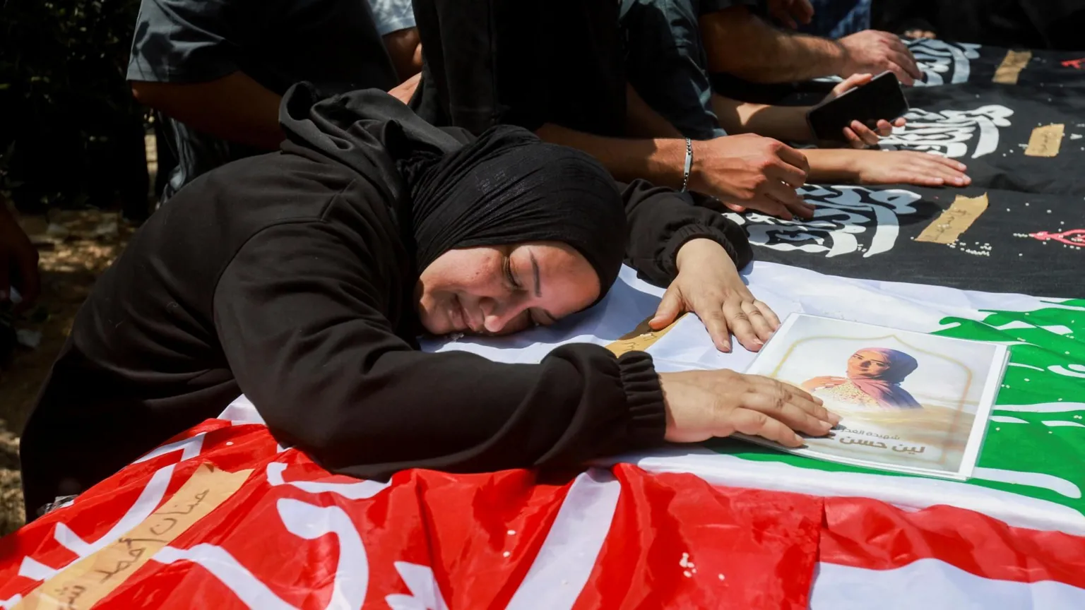 Mourners gather for a funeral in Wardaniyeh, southern Lebanon, for six family members killed in Israeli strikes.