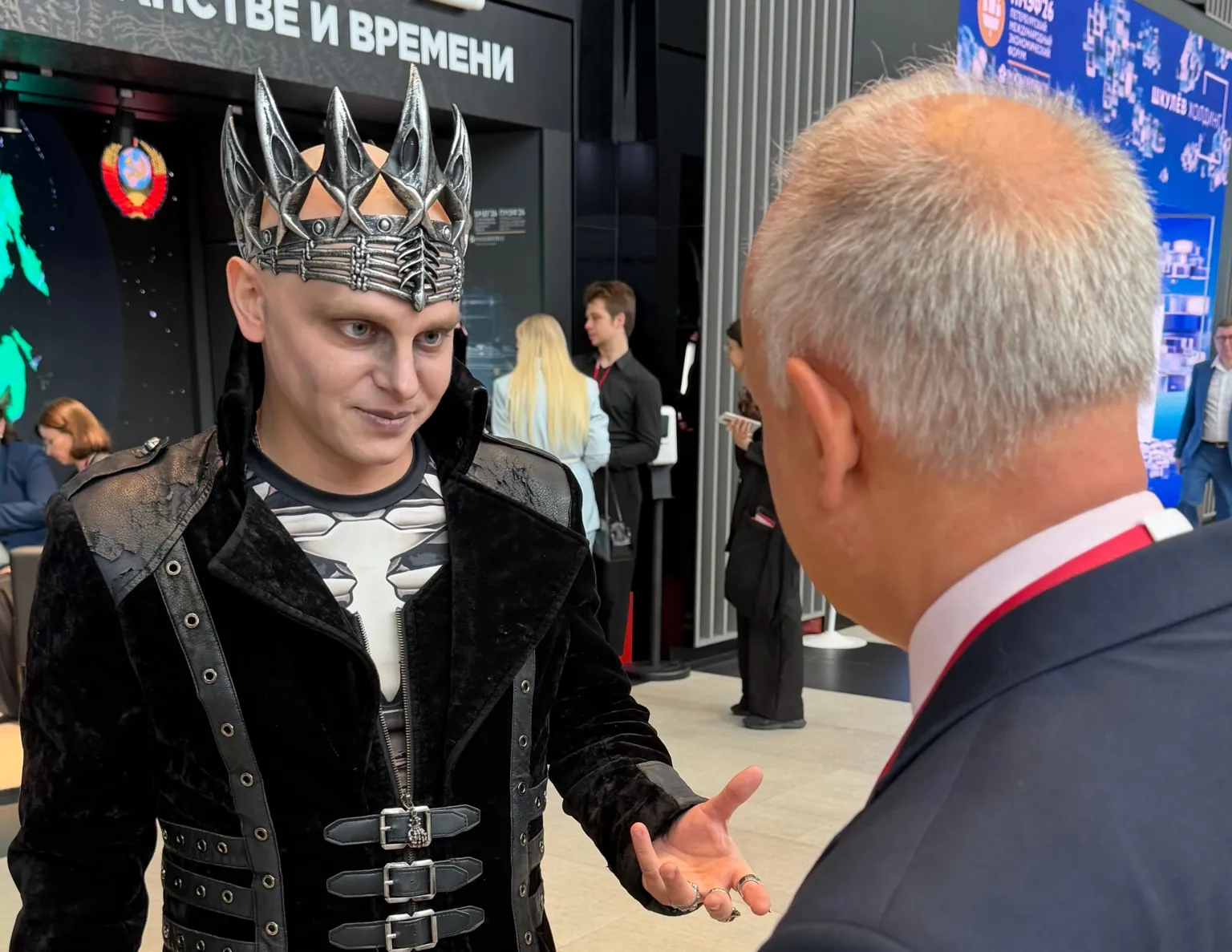 A costumed performer at St. Petersburg International Economic Forum amid ongoing military tensions.