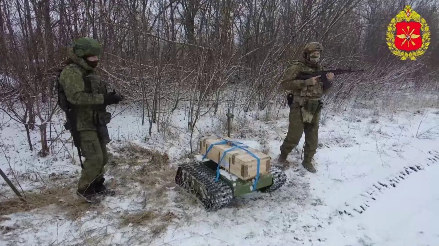 Russian soldiers operate an explosives-laden Frog kamikaze drone vehicle in combat.