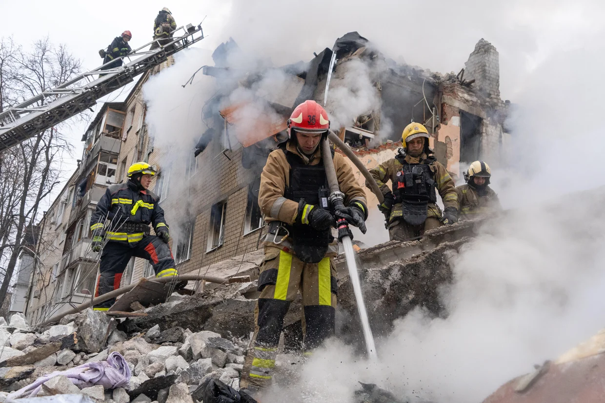 Firefighters put out the fire in the ruins of an apartment building following Russia's missile attack in Kharkiv, Ukraine, Saturday, March 7, 2026.Andrii Marienko / AP