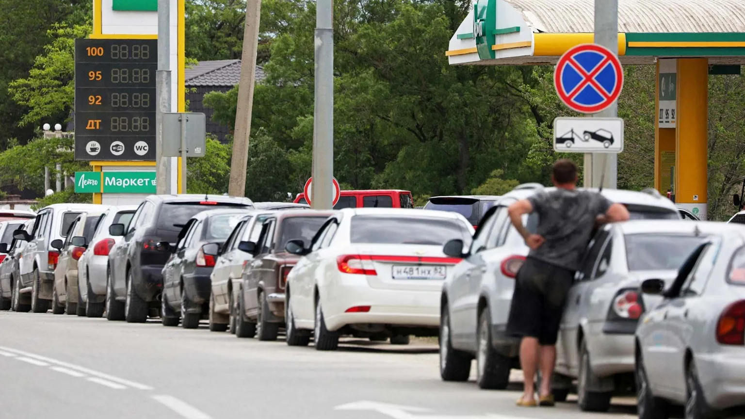 Long queues stretch at Crimean petrol stations as residents wait hours to purchase limited fuel supplies.