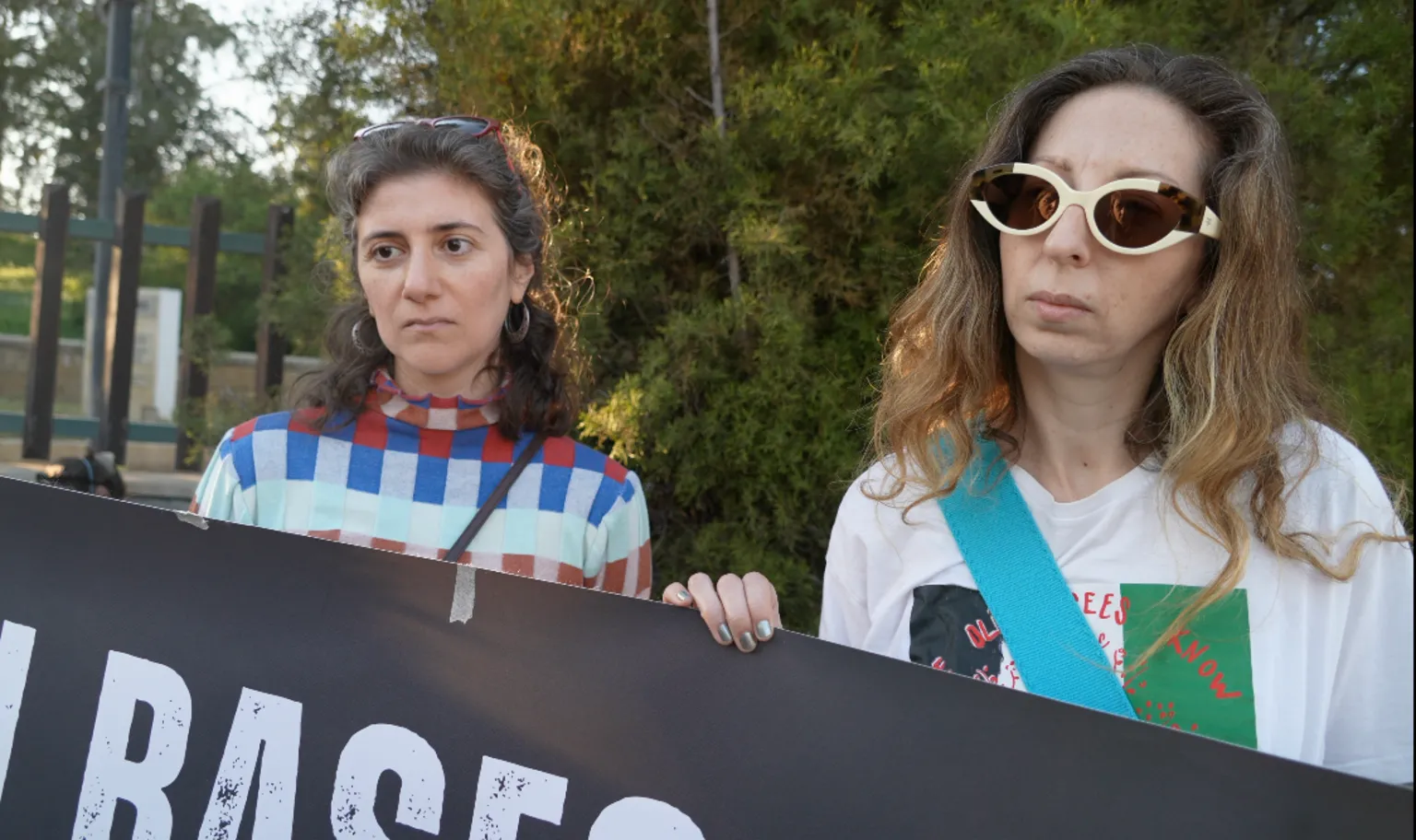 Activists Natasha Theodotou and Shona Muir demonstrate against British military bases during protest following Hezbollah drone strike.