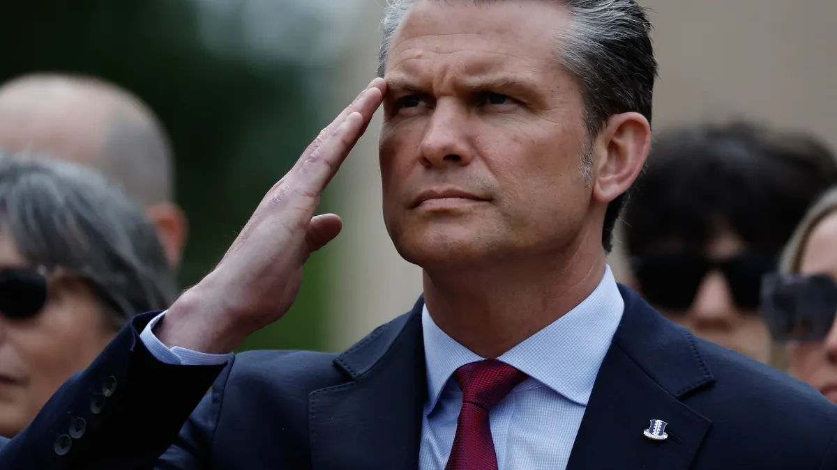 US Defense Secretary Pete Hegseth salutes during a ceremony to mark the D-Day landings on June 6 [Jeremias Gonzalez/AP Photo]