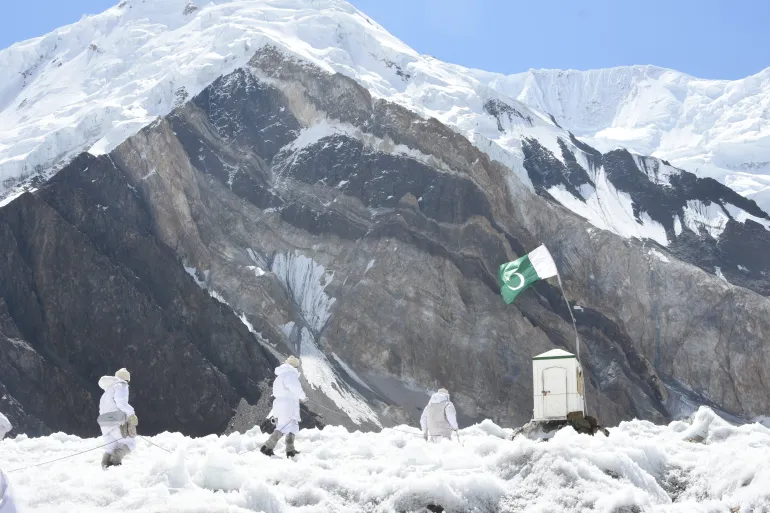 Pakistani soldiers stationed at remote post near Siachen Glacier in mountainous border region.