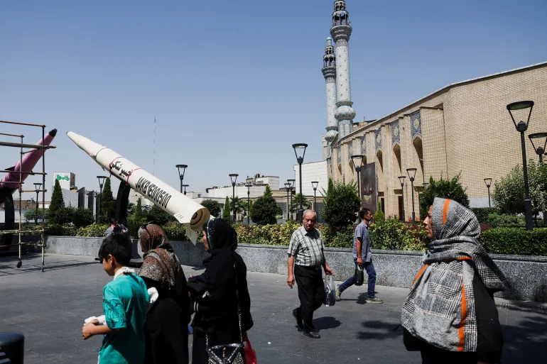 Symbolic Iranian missile mock-up displayed in Tehran during disputed ceasefire announcement negotiations.