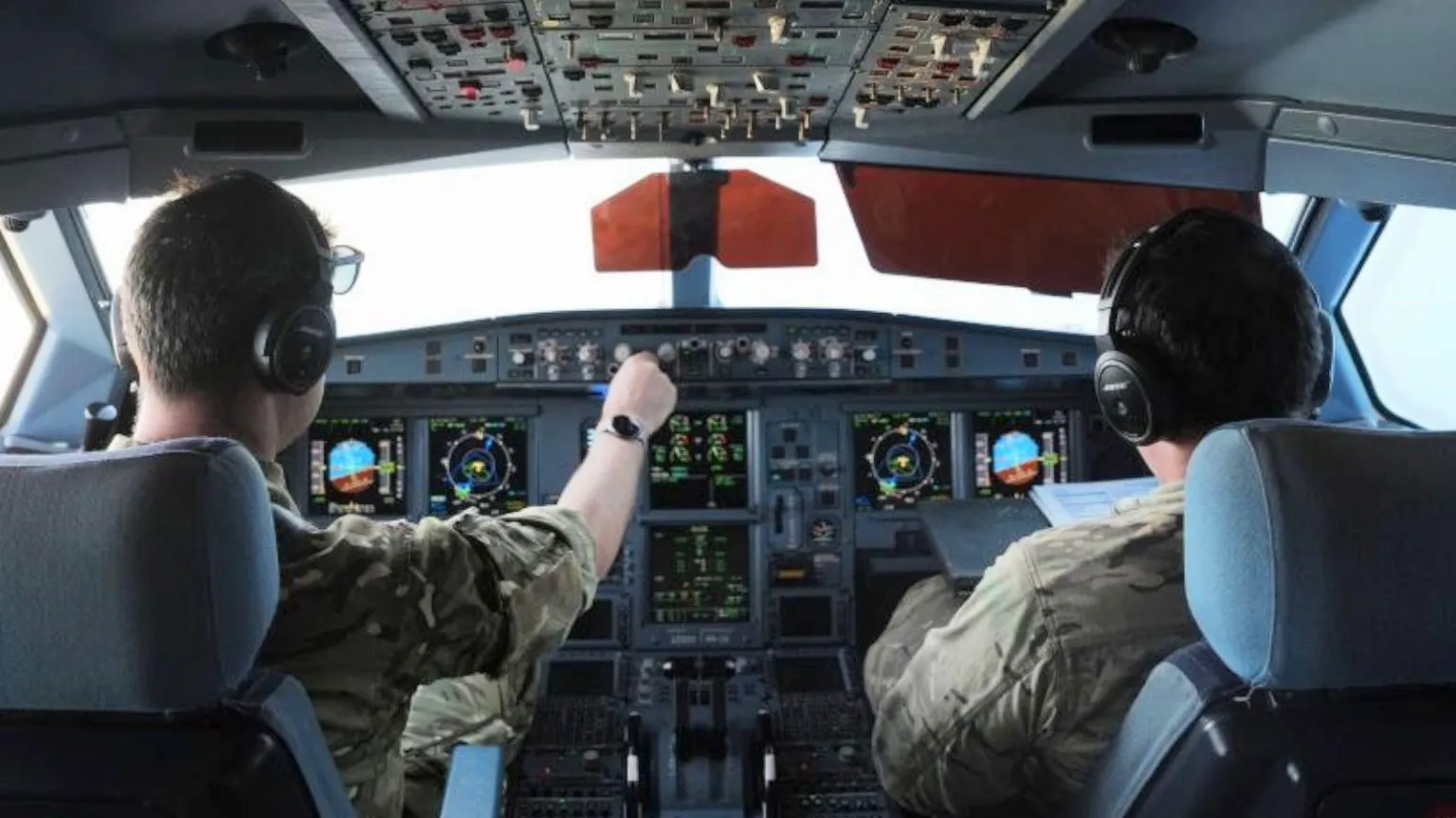 RAF Voyager crew members monitor refuelling operations from the cockpit above RAF Akrotiri in the eastern Mediterranean.