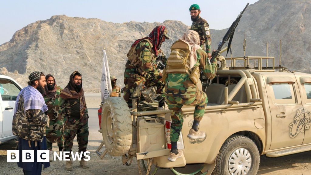 Armed Taliban soldiers operate heavy weaponry amid the two-day offensive that killed hundreds in the Pakistan-Afghanistan conflict.