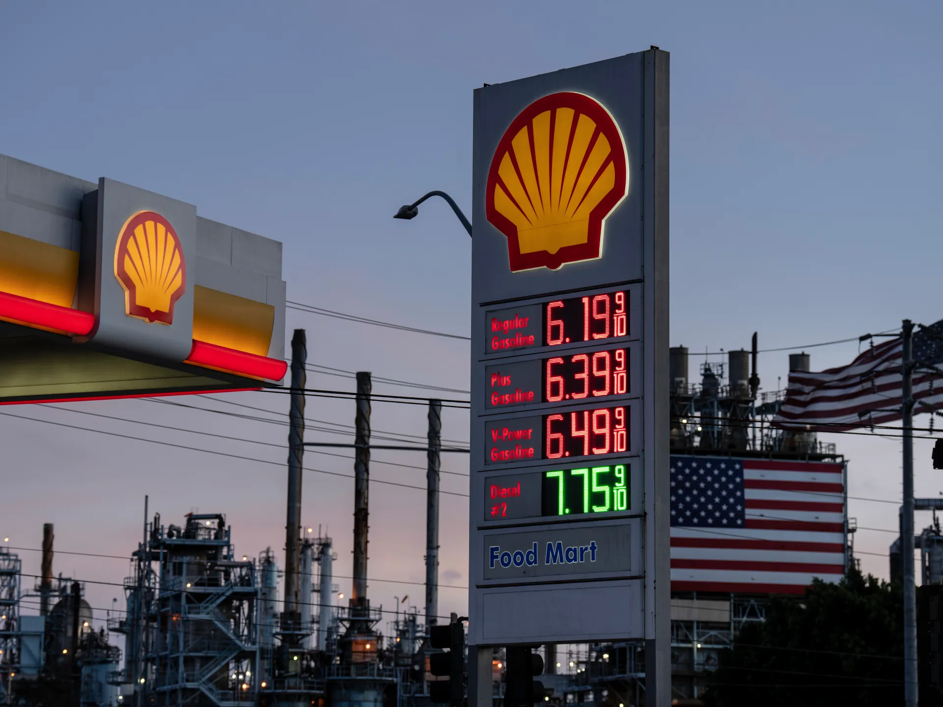 Fuel prices are displayed at a Shell station at the Marathon Petroleum refinery in California [File: Jae C Hong/AP]