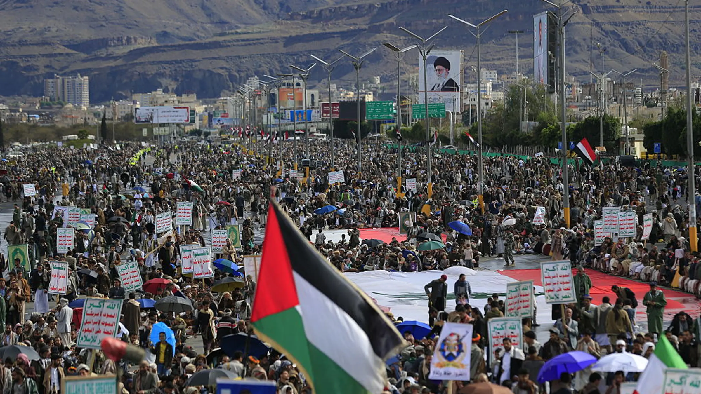 A Palestinian flag is raised as Houthis rally in solidarity with Iran and Lebanon, amid the US-Israeli war with Iran, in the Yemeni capital Sanaa on March 27, 2026.Mohammed Huwais—AFP via Getty Images