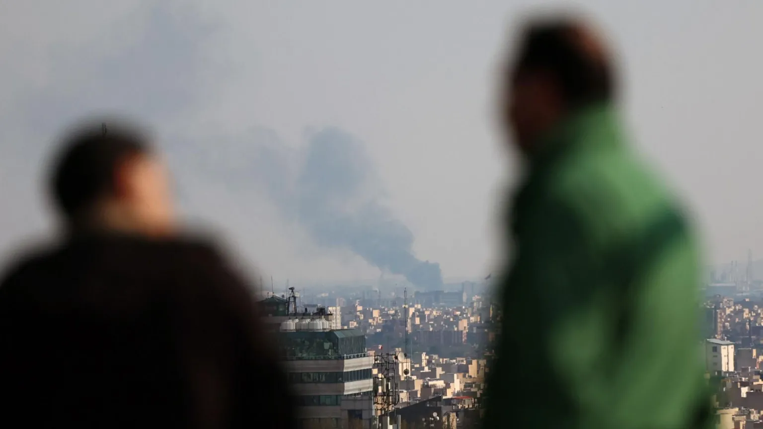 Smoke billows from airstrike in central Tehran as nightly bombardments reshape civilian life across Iran.