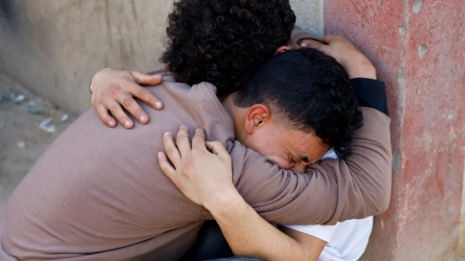 Relatives of those killed during the clashes mourned outside al-Aqsa hospital in Deir al-Balah