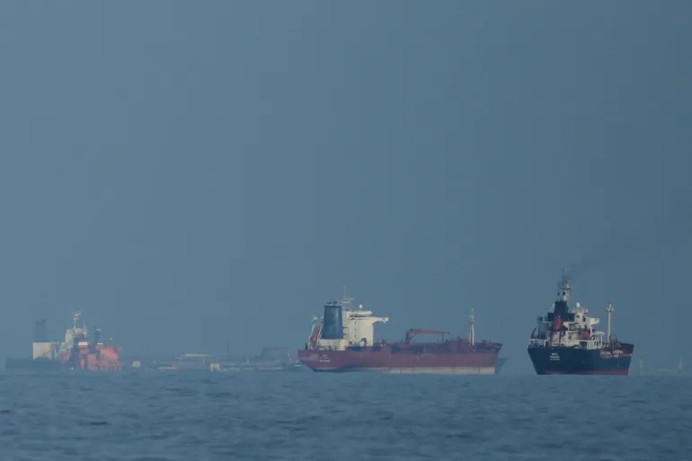 Oil tankers and cargo ships line up in the Strait of Hormuz, as seen from Khor Fakkan, the United Arab Emirates, on March 11, 2026 [Altaf Qadri/AP]