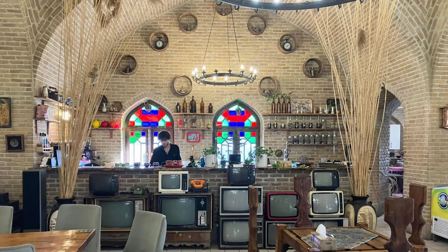 Historic Iranian building repurposed as roadside restaurant amid uncertainty over nuclear negotiations and sanctions.
