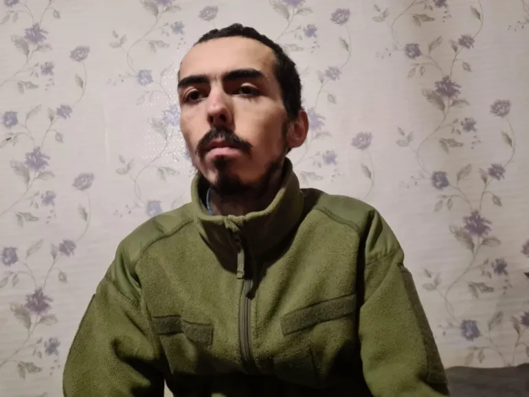 Hushruzjon Salohidinov, 26, a Tajik migrant coerced into fighting for Russia, at a POW facility.