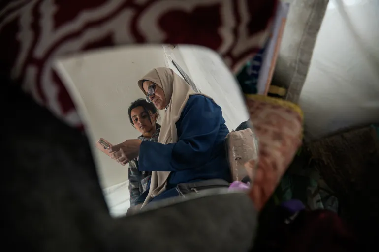 Inaam cares for her six grandchildren while awaiting the release of her three detained sons from Israeli prisons.