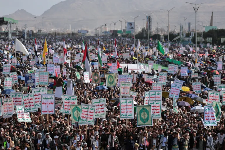 Houthi supporters demonstrate in solidarity with Iran, in Sanaa, Yemen, on Friday [Khaled Abdullah/Reuters]