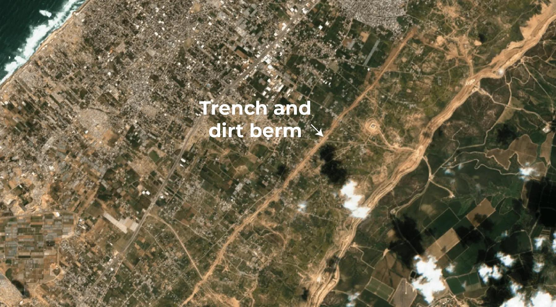 Israeli military vehicle tracks visible beyond demarcation line in northern Gaza on March 4, 2026.