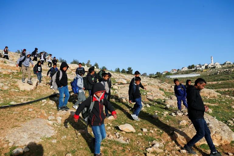 Students in Umm al-Khair village face a settler-installed fence preventing direct access to their classrooms for nearly two months.