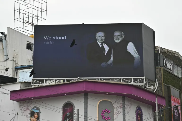 A digital billboard in India displays Modi and Putin shaking hands, symbolizing the new military partnership.