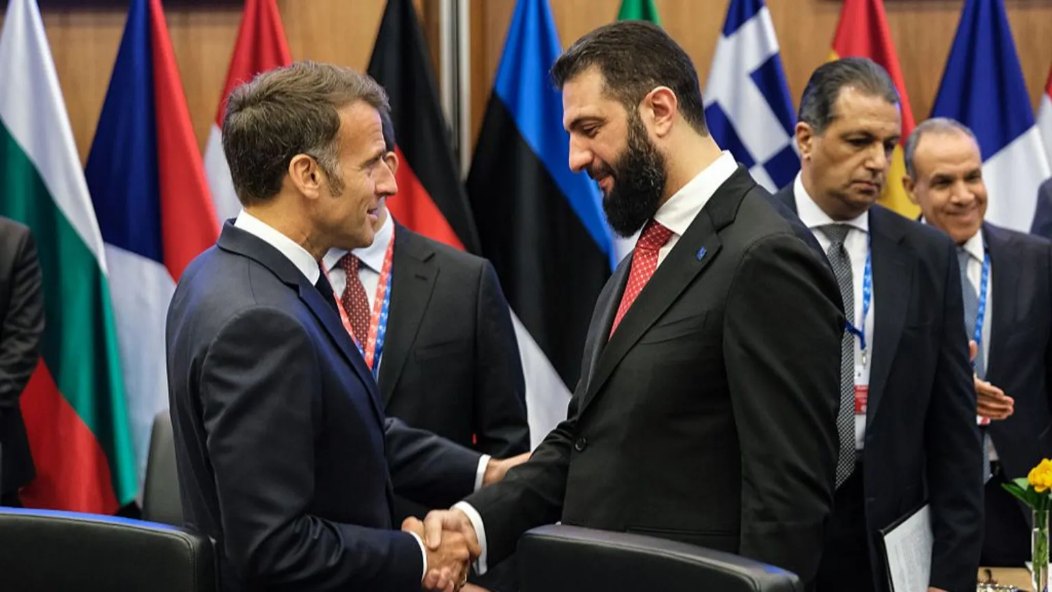 French President Emmanuel Macron meets Syrian President Ahmed al-Sharaa amid broader NATO alliance tensions over Iran policy.