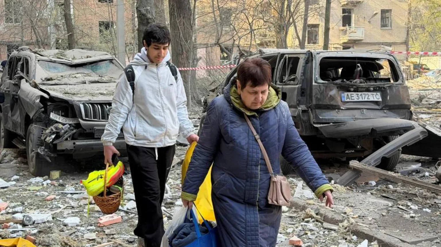 Rescue workers search for survivors in Dnipro rubble as residents evacuate following massive Russian drone and missile barrage.