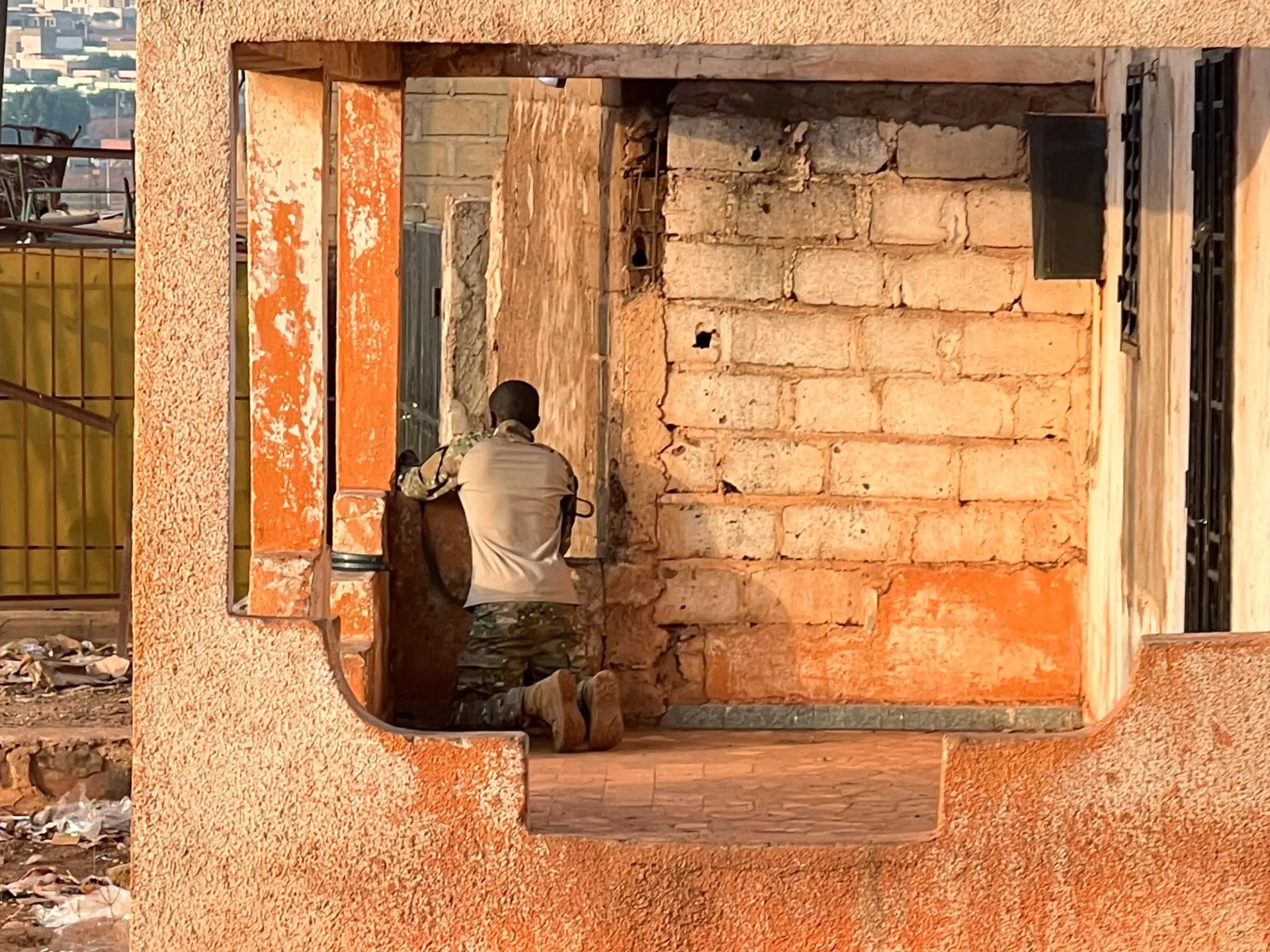 A Malian soldier stands in position with his weapon during an attack on Mali's main military base Kati outside the capital Bamako, Mali, on April 25, 2026 [Stringer/Reuters]