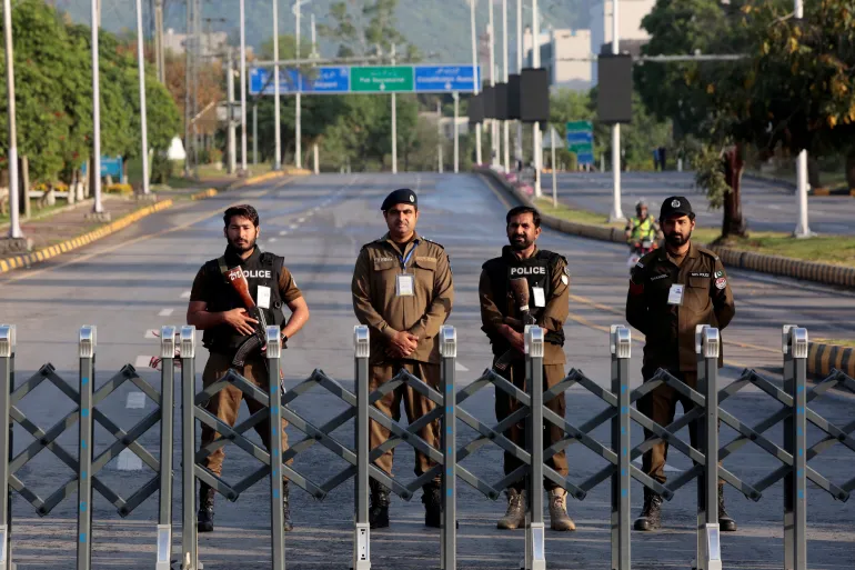 Police officers stand guard behind a barricade near Serena Hotel, as Pakistan prepares to host the US and Iran for the second round of peace talks, in Islamabad, Pakistan, April 25, 2026 [Asim Hafeez/Reuters]