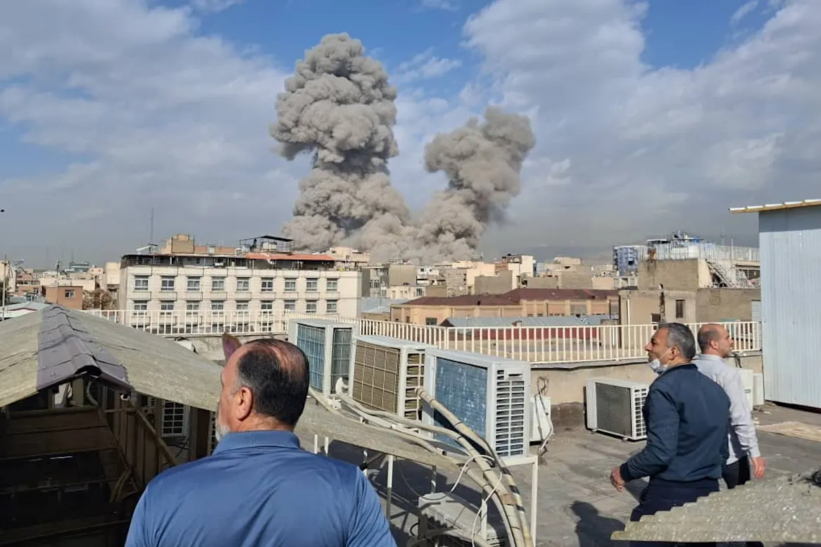 Smoke rises after an explosion in Tehran.AP