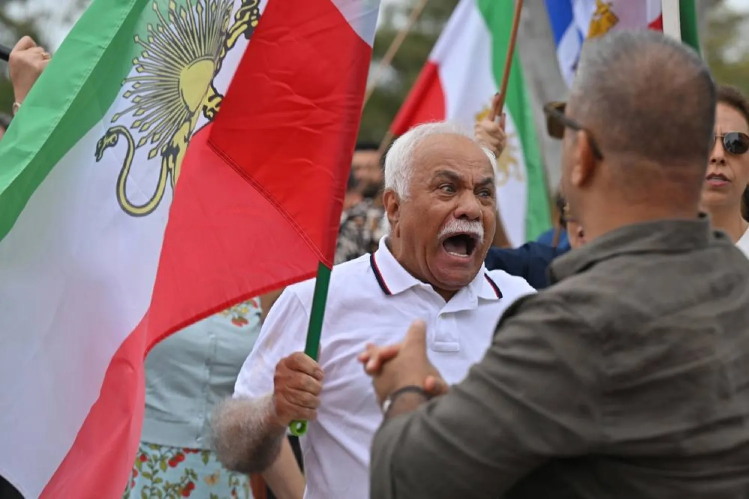 Members of the Iranian diaspora celebrate following US and Israeli military strikes on Iran, outside the Embassy of Iran in Canberra, Australia, 01 March 2026. (EPA)