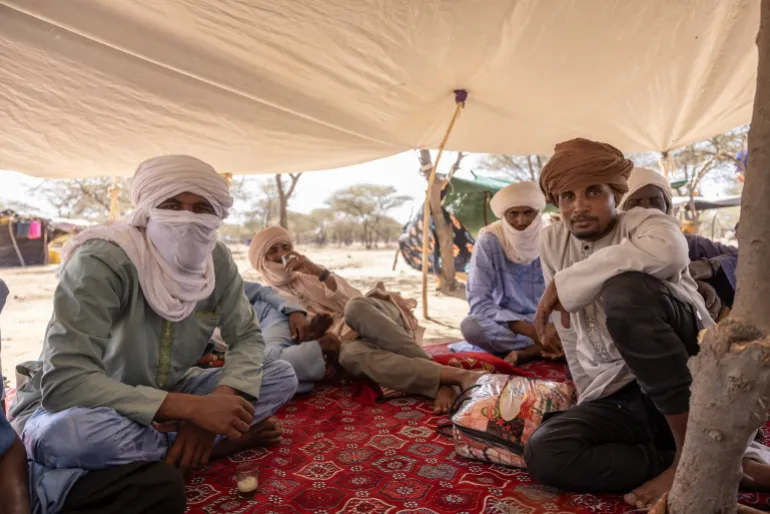 Northern Mali residents who fled military and paramilitary attacks shelter in a makeshift camp.