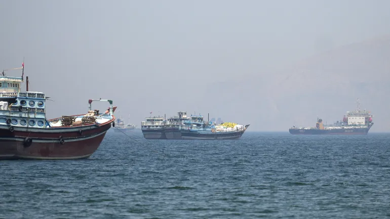 Ships transit the Strait of Hormuz as U.S.-Iran tensions escalate over nuclear program disputes.