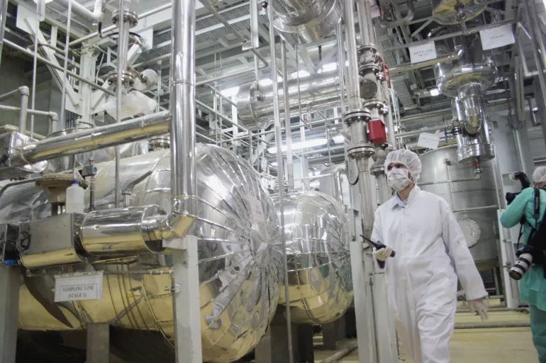 A worker inspects Iran's uranium conversion facility near Isfahan, a key site in nuclear negotiations with the United States.