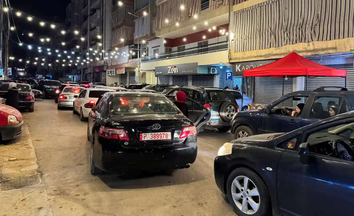 People leave in their cars after Israeli strikes on Beirut's southern suburbs.