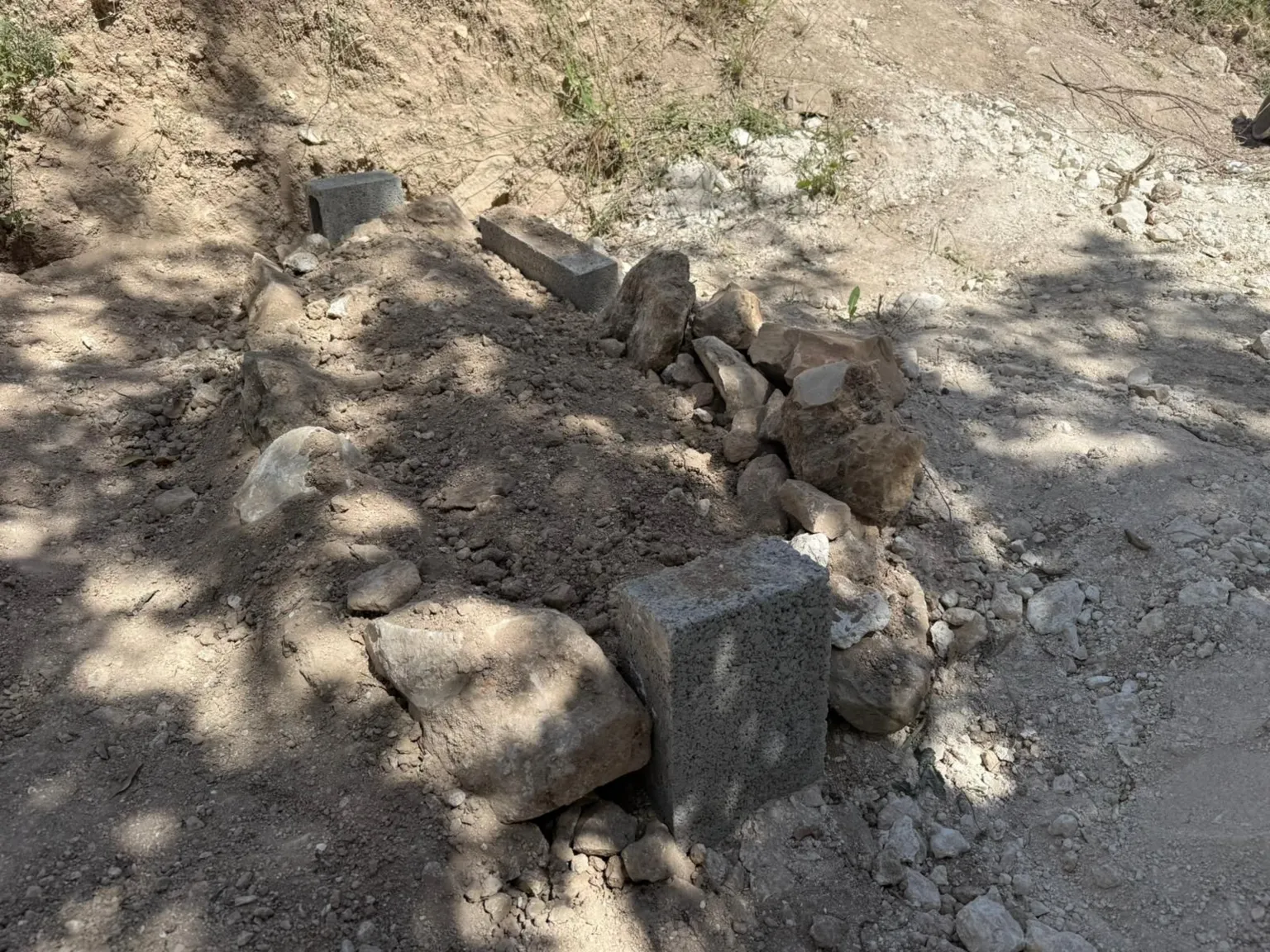 Settlers from Sa-Nur settlement dig up Hussein Asasa's grave minutes after his burial.