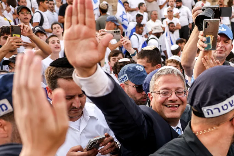 National Security Minister Itamar Ben-Gvir, surrounded by police, participates in Jerusalem Day march through Old City.