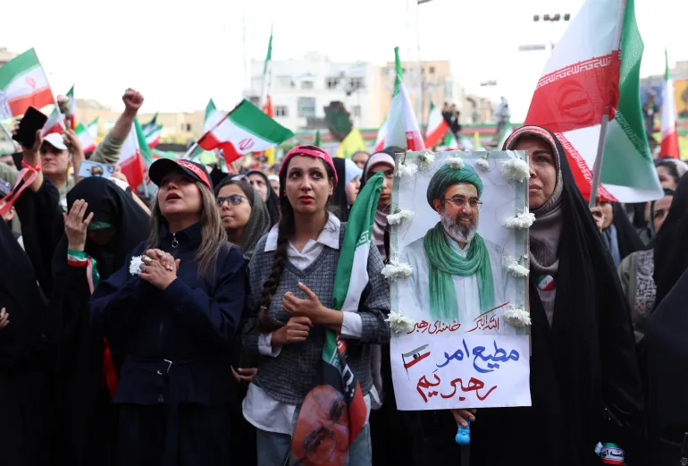 Iranians rally in support of Supreme Leader Ayatollah Mojtaba Khamenei as tensions escalate over regional military threats.